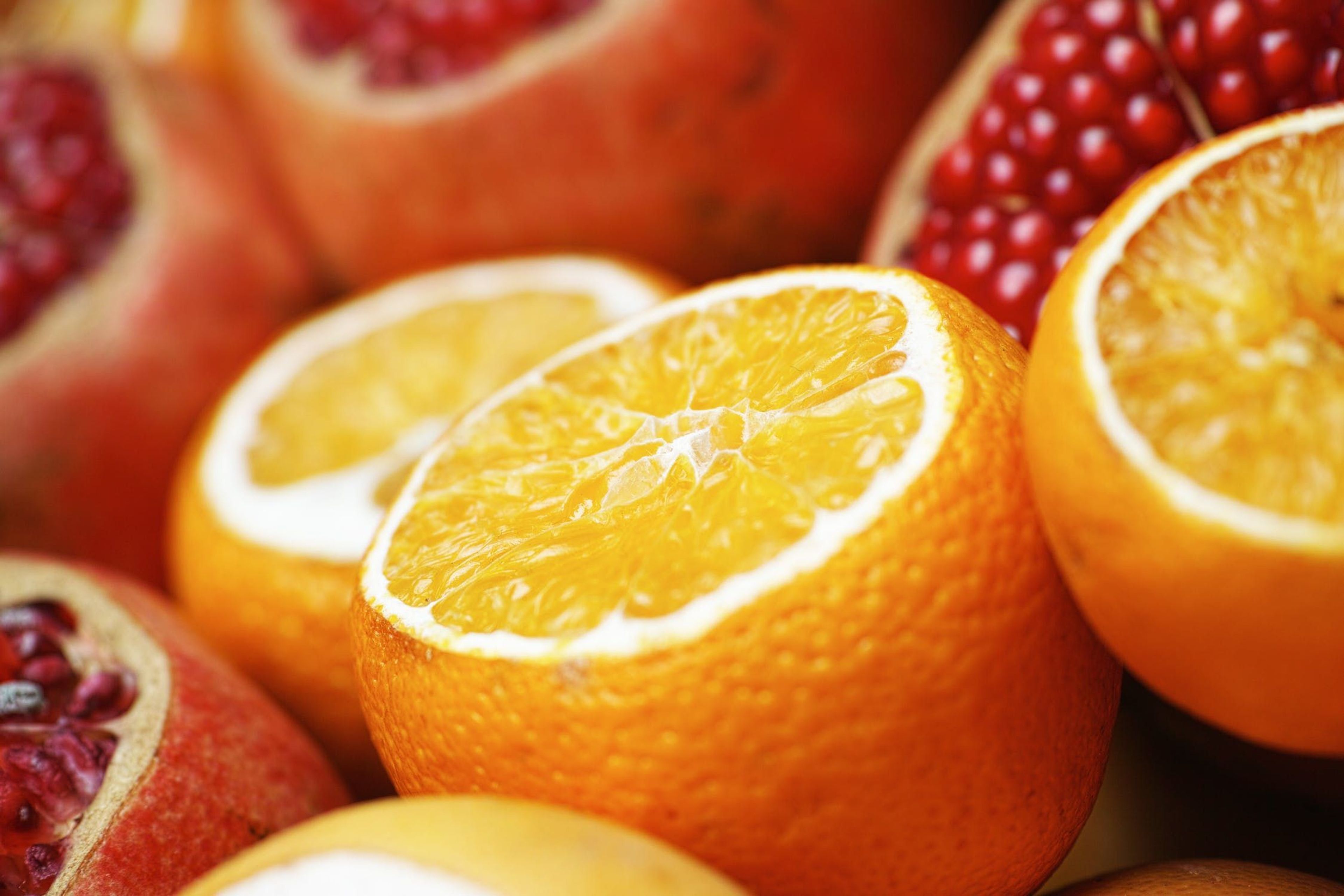 Close-up of oranges and pomegranate