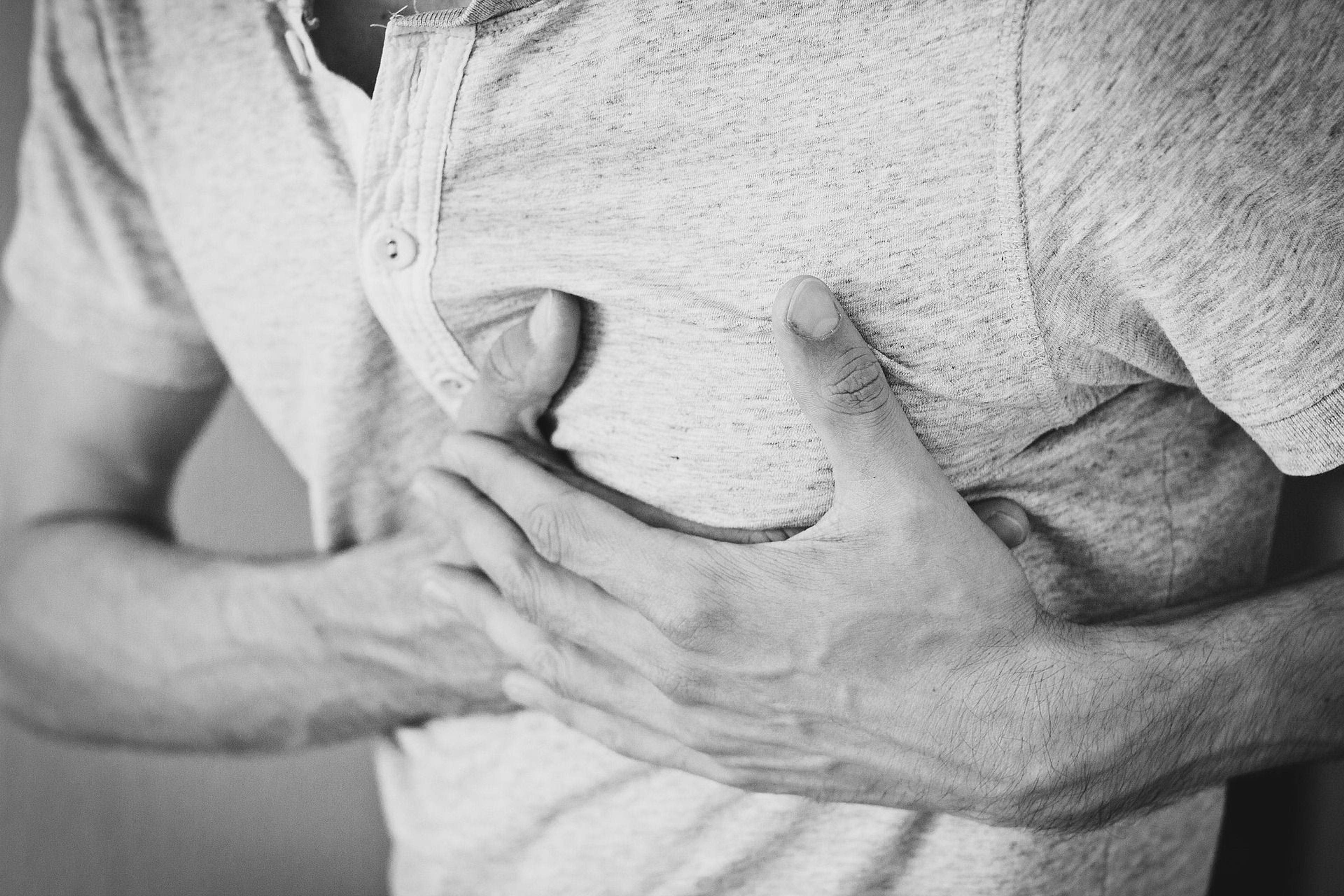 Man holding his chest in pain